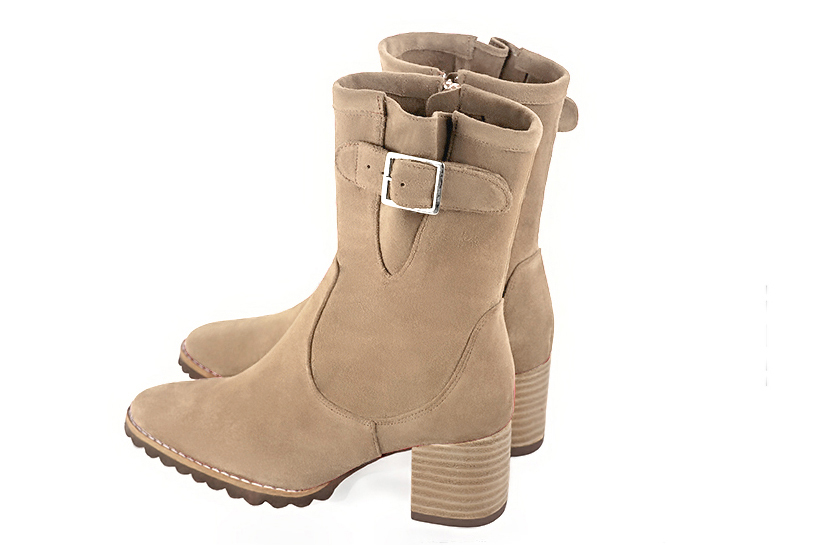 Tan beige women's ankle boots with buckles on the sides. Round toe. Medium block heels. Rear view - Florence KOOIJMAN